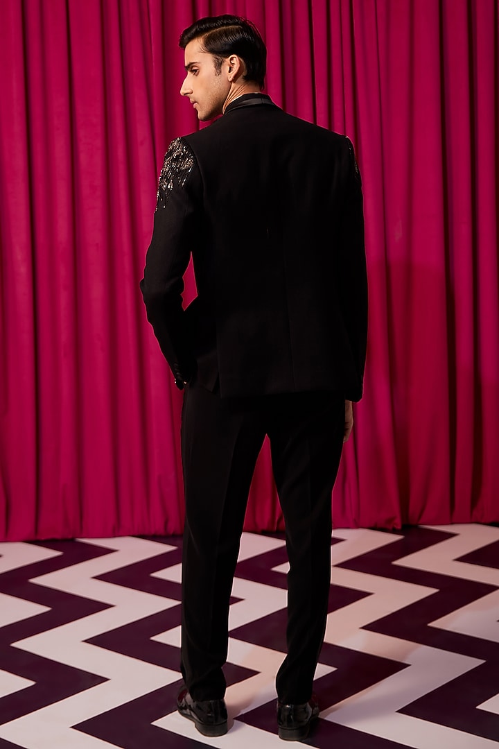Black Textured Suiting Embroidered Tuxedo Set by Contrast By Parth at Pernia's Pop Up Shop