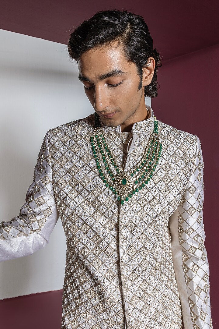 Off-White Raw Silk Hand & Machine Embroidered Groom Sherwani Set by Contrast By Parth at Pernia's Pop Up Shop