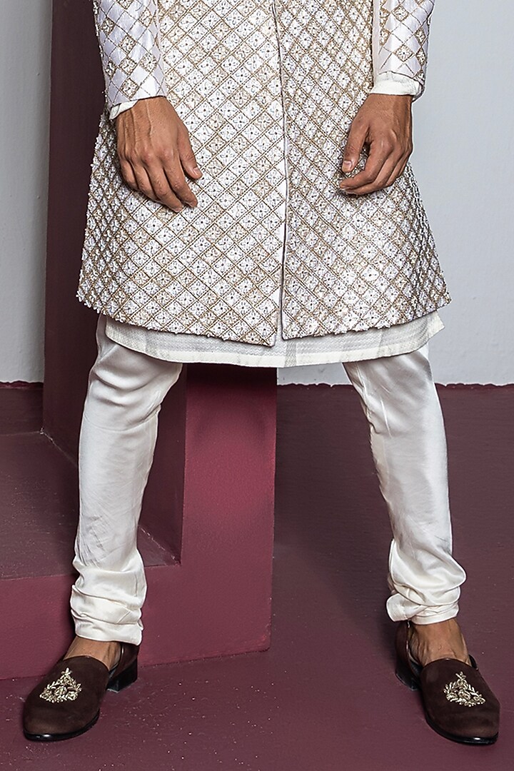 Off-White Raw Silk Hand & Machine Embroidered Groom Sherwani Set by Contrast By Parth at Pernia's Pop Up Shop