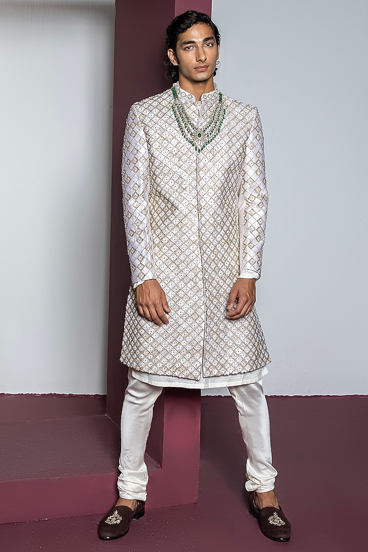 Off-White Raw Silk Hand & Machine Embroidered Groom Sherwani Set by Contrast By Parth at Pernia's Pop Up Shop