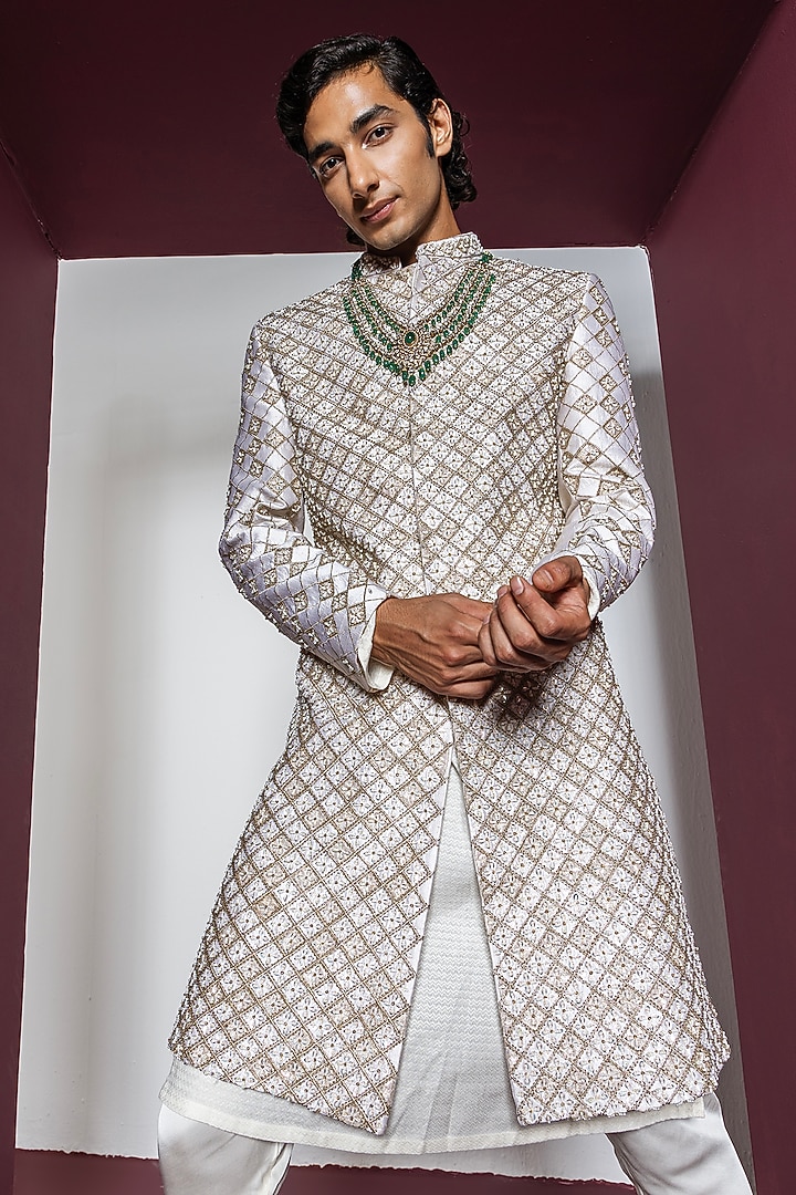 Off-White Raw Silk Hand & Machine Embroidered Groom Sherwani Set by Contrast By Parth at Pernia's Pop Up Shop