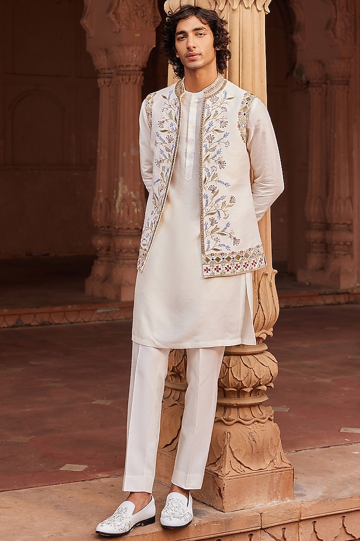 Ivory Raw Silk Cutdana & Mirror Work Nehru Jacket Set by Contrast By Parth at Pernia's Pop Up Shop