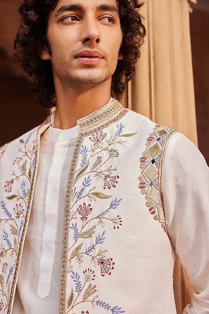 Ivory Raw Silk Cutdana & Mirror Work Nehru Jacket Set by Contrast By Parth at Pernia's Pop Up Shop