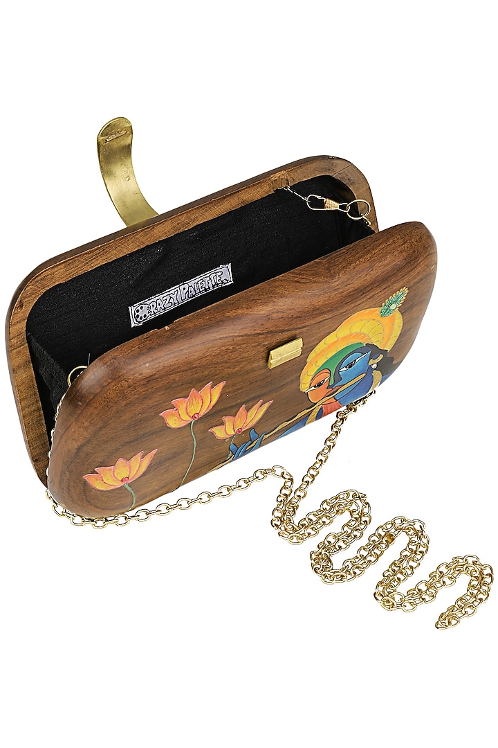 Crazy Palette presents Brown Wooden lord Krishna Clutchavailable only at Pernia's Pop Up Shop.