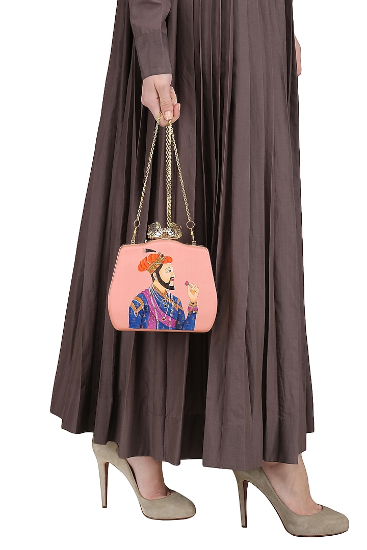 Peach maharaja motif clutch available only at Pernia's Pop Up Shop.
