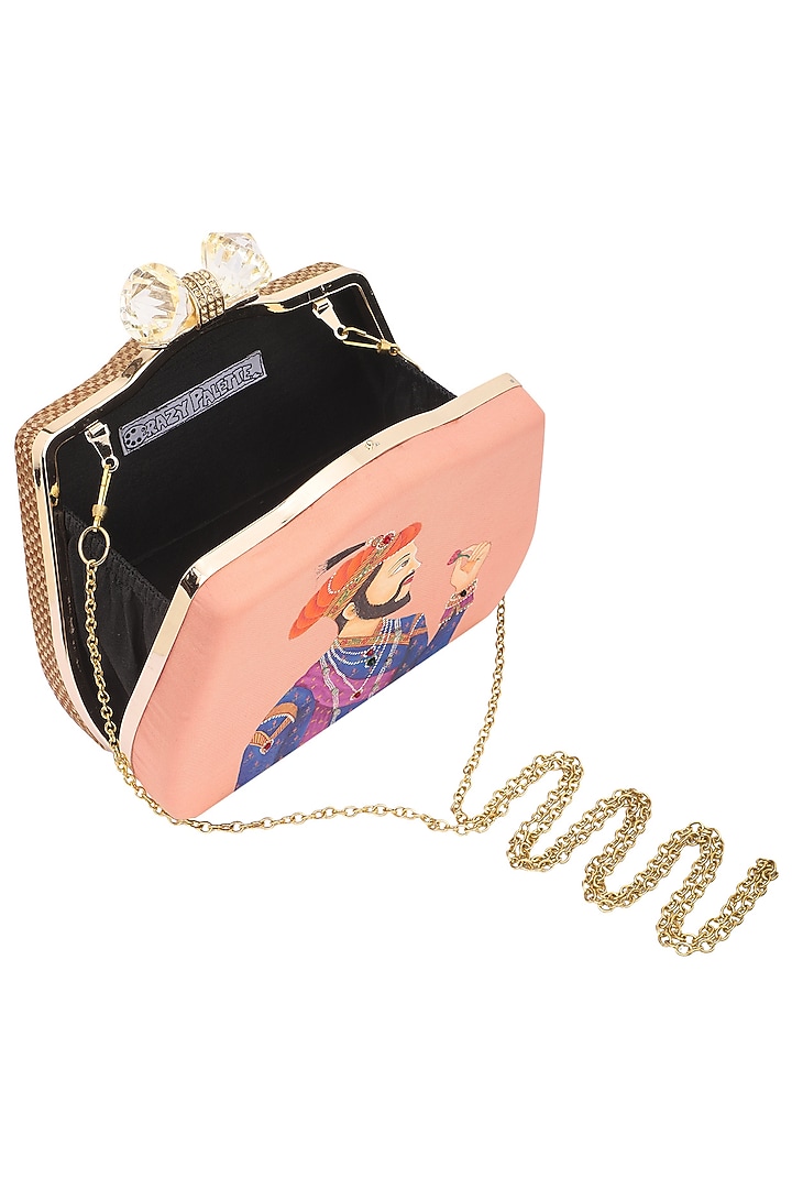 Peach maharaja motif clutch available only at Pernia's Pop Up Shop.