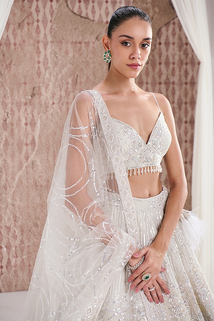 Ivory Organza Sequins Embroidered Jacket Bridal Lehenga Set by DISHA ARORA at Pernia's Pop Up Shop