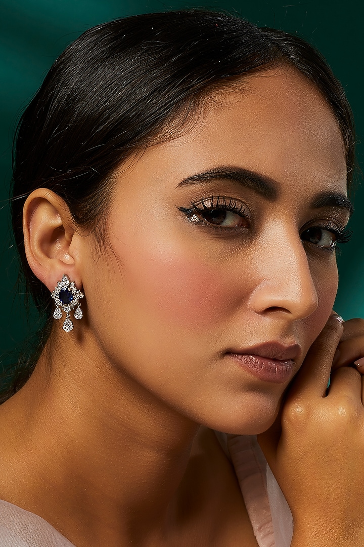 White Finish White & Blue Swarovski Zirconia Dangler Earrings In Sterling Silver by Diosa Paris Jewellery at Pernia's Pop Up Shop