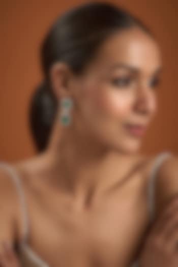 White Finish Synthetic Emerald Stone Dangler Earrings In Sterling Silver by Diosa Paris Jewellery at Pernia's Pop Up Shop