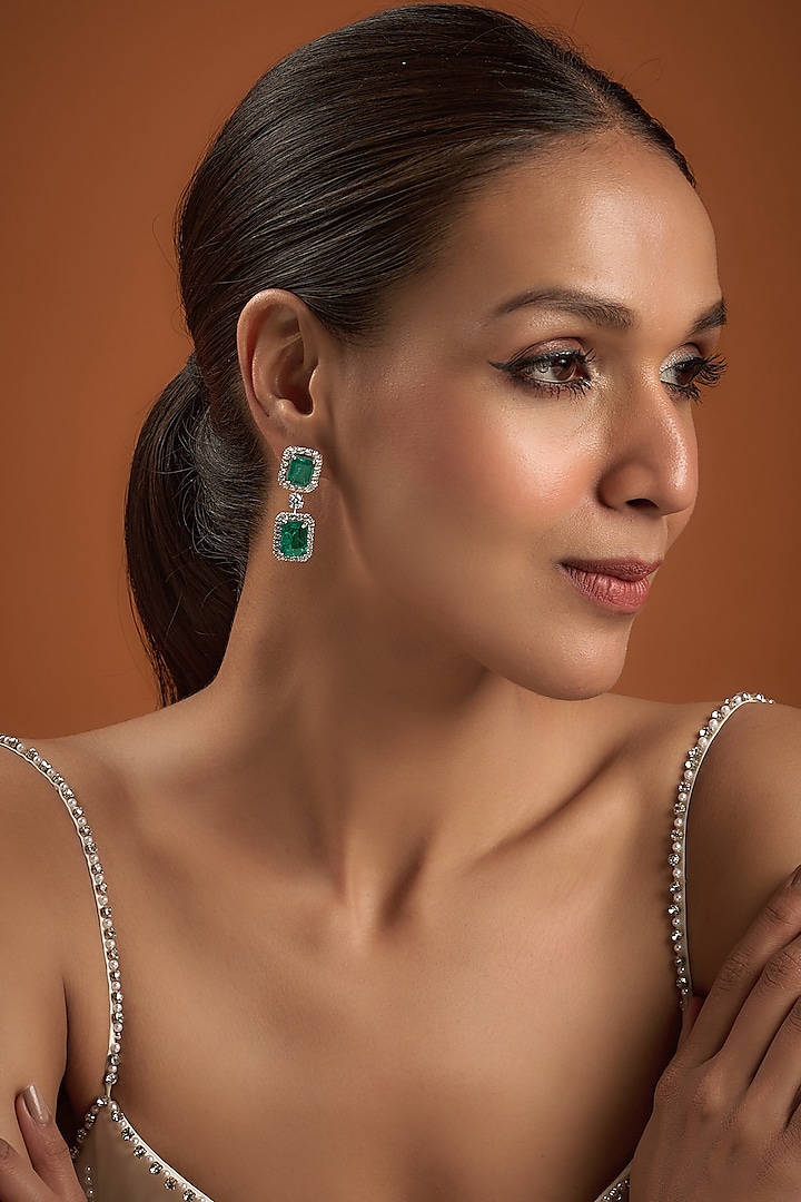White Finish Synthetic Emerald Stone Dangler Earrings In Sterling Silver by Diosa Paris Jewellery at Pernia's Pop Up Shop