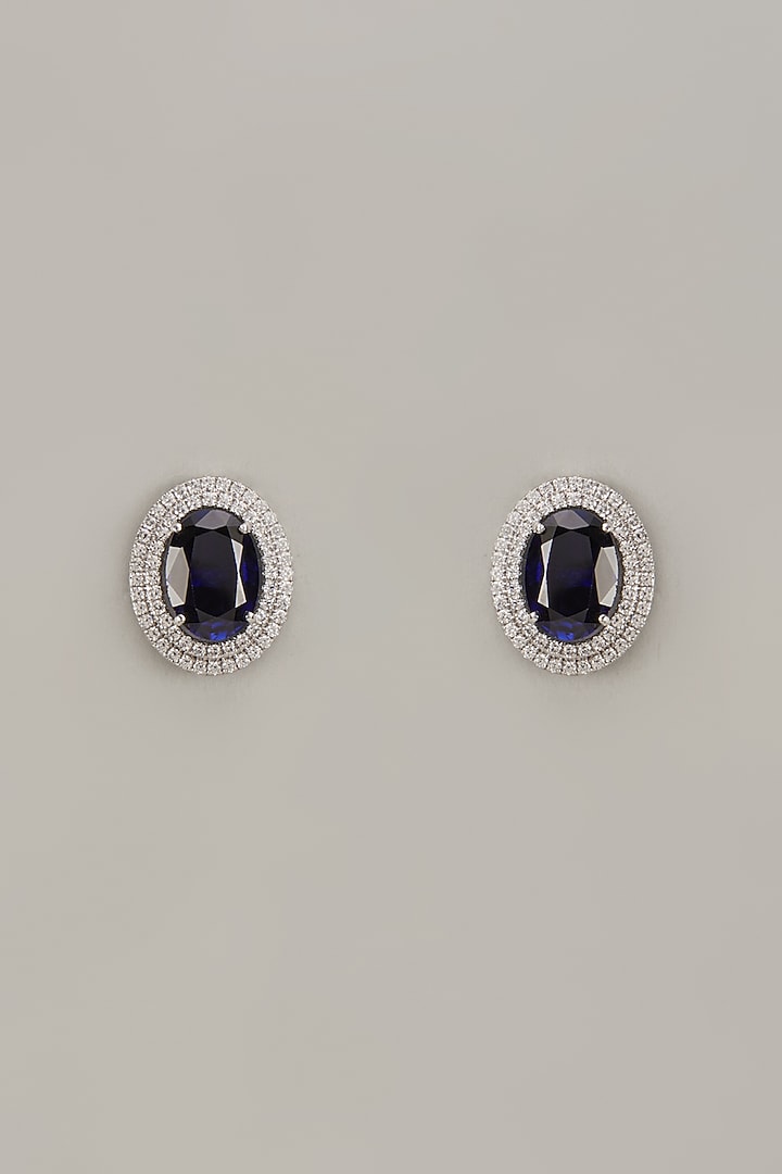 White Finish Zircon & Synthetic Sapphire Stone Stud Earrings In Sterling Silver by Diosa Paris Jewellery at Pernia's Pop Up Shop