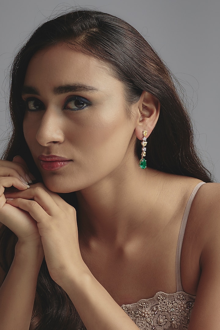 White Finish Zircon & Synthetic Emerald Stone Dangler Earrings In Sterling Silver by Diosa Paris Jewellery at Pernia's Pop Up Shop