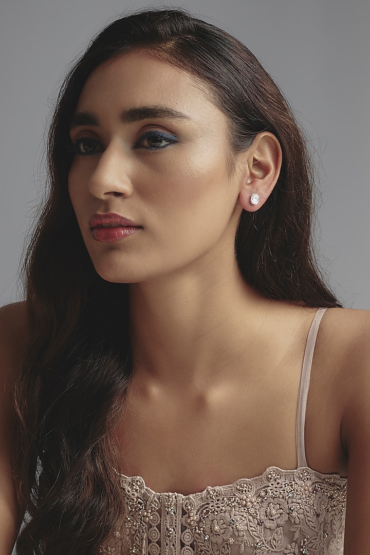 White Finish Oval Cut Swarovski Zirconia Stud Earrings In Sterling Silver by Diosa Paris Jewellery at Pernia's Pop Up Shop