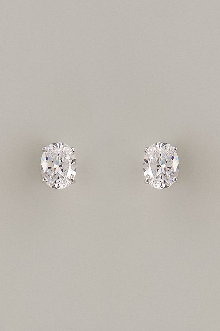 White Finish Oval Cut Swarovski Zirconia Stud Earrings In Sterling Silver by Diosa Paris Jewellery at Pernia's Pop Up Shop