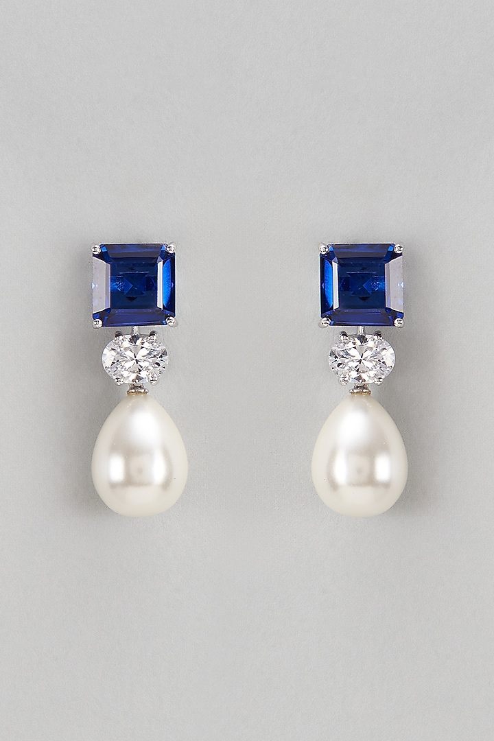 White Finish Swarovski & Synthetic Blue Stone Dangler Earrings In Sterling Silver by Diosa Paris Jewellery at Pernia's Pop Up Shop