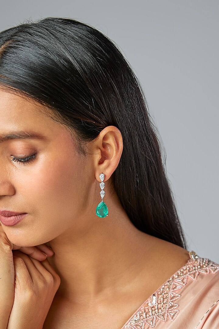 White Finish Zircon & Emerald Stone Dangler Earrings In Sterling Silver by Diosa Paris Jewellery at Pernia's Pop Up Shop