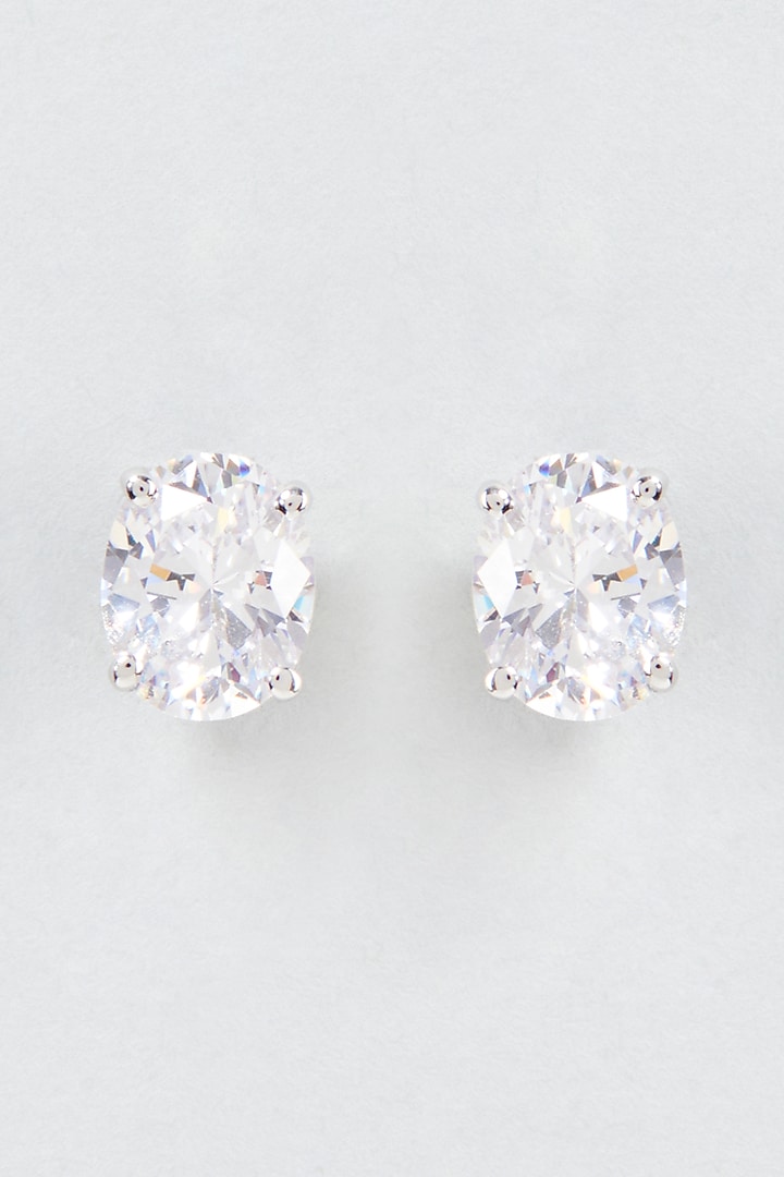 White Finish Oval Cut Swarovski Zirconia Stud Earrings In Sterling Silver by Diosa Paris Jewellery at Pernia's Pop Up Shop