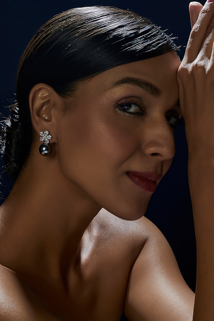 White Finish Pear Cut Swarovski Zirconia Dangler Earrings In Sterling Silver by Diosa Paris Jewellery at Pernia's Pop Up Shop