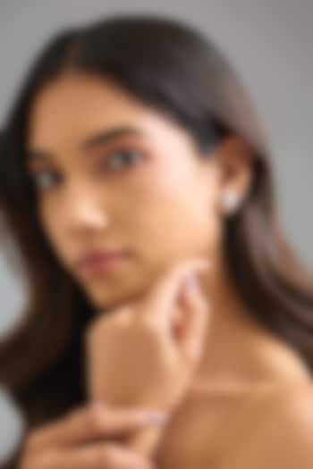 White Finish White Stone Stud Earrings In Sterling Silver by Diosa Paris Jewellery at Pernia's Pop Up Shop