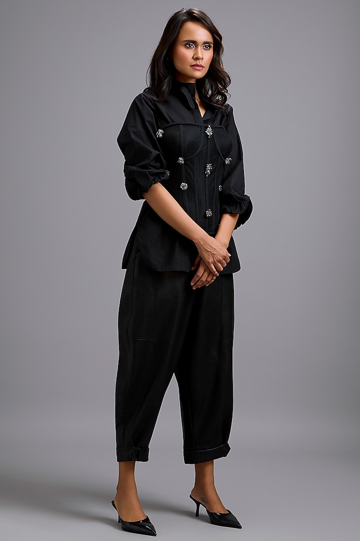 Black Vegan Leather Cuffed Pants by Deepika Arora at Pernia's Pop Up Shop