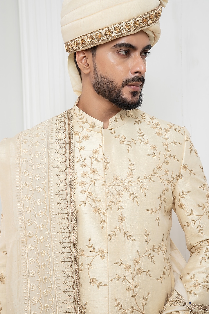 Beige Raw Silk Floral Motif Embroidered Wedding Sherwani Set by Darshika at Pernia's Pop Up Shop