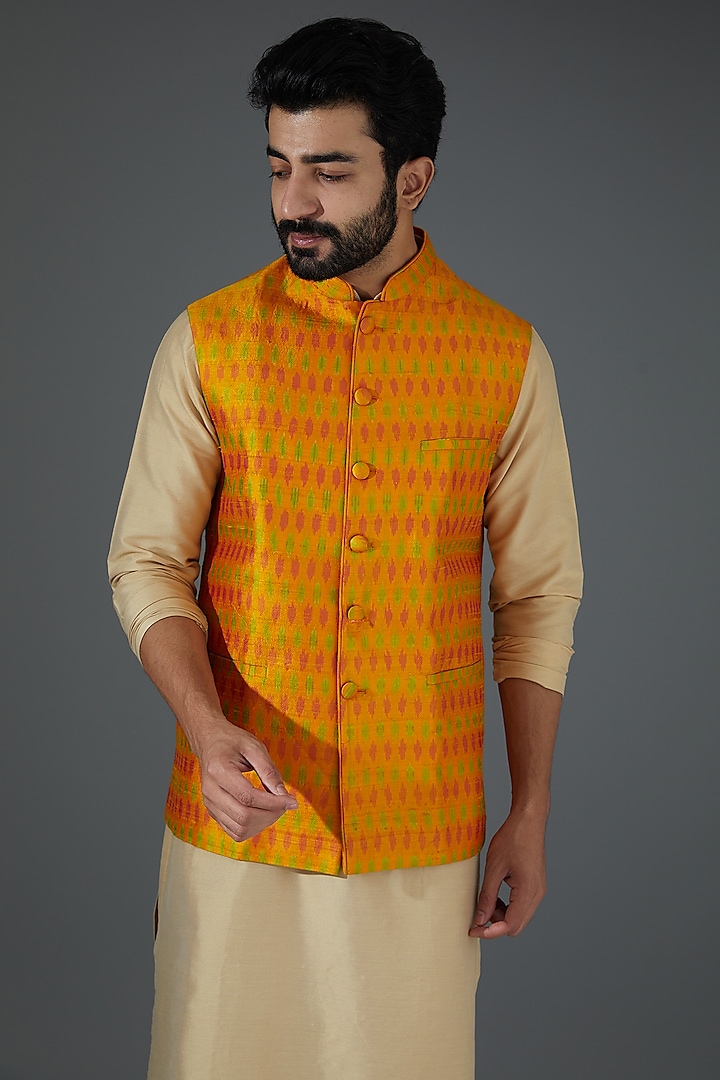 Orange Raw Silk Ikat Printed Bundi Jacket by Darshika