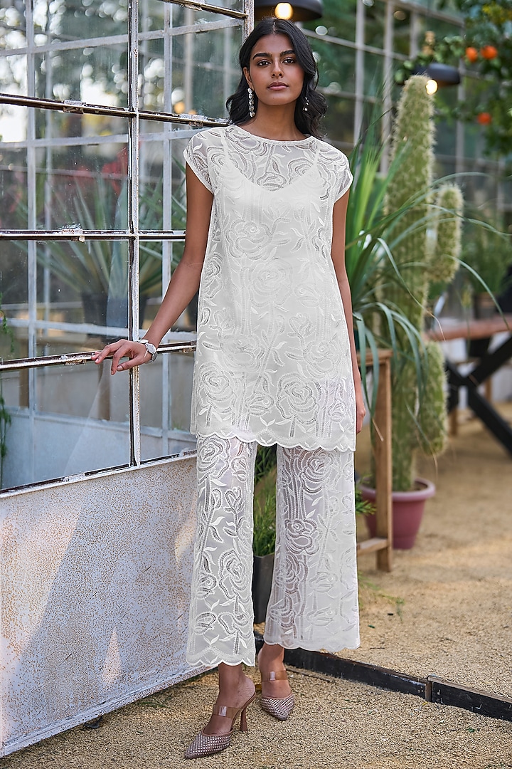 Ivory Recycled Polyester Pants by Dash and Dot at Pernia's Pop Up Shop