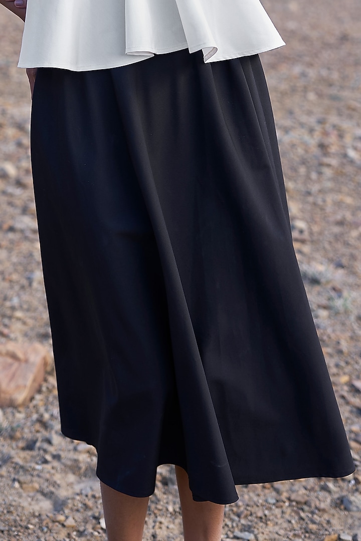 Black Viscose & Spandex A-Line Midi Skirt by Dash and Dot at Pernia's Pop Up Shop
