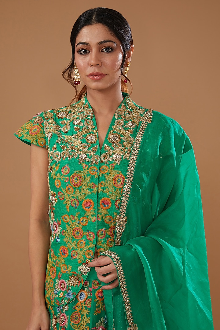 Green Raw Silk Embroidered Jacket Wedding Lehenga Set by Debyani at Pernia's Pop Up Shop