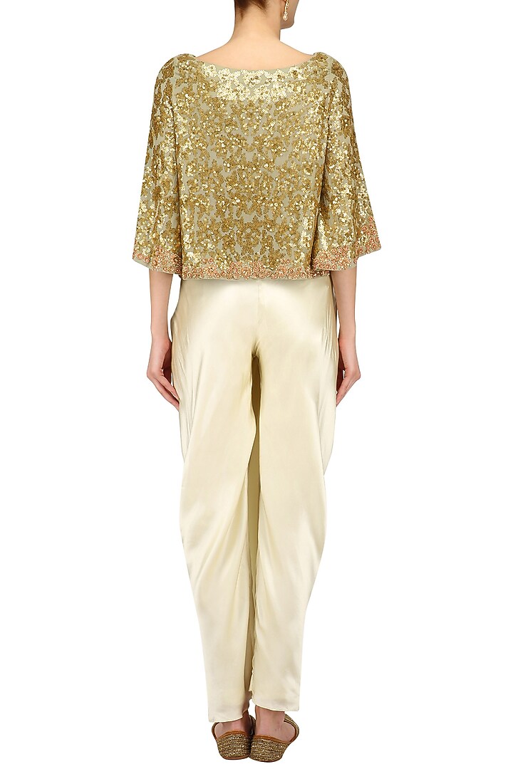 Golden sequins embroidered kaftan top and ivory dhoti skirt set available only at Pernia's Pop Up Shop.