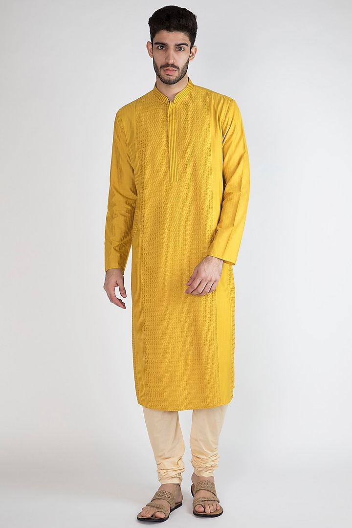 Yellow Pintex Kurta With Churidar Pants by Devanshi Didwania