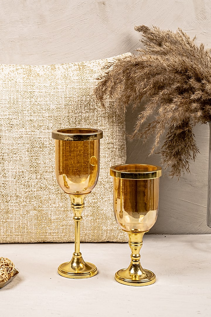 Gold Glass & Metal Hurricane Candle Holder (Set of 2) by The 7 Dekor at Pernia's Pop Up Shop