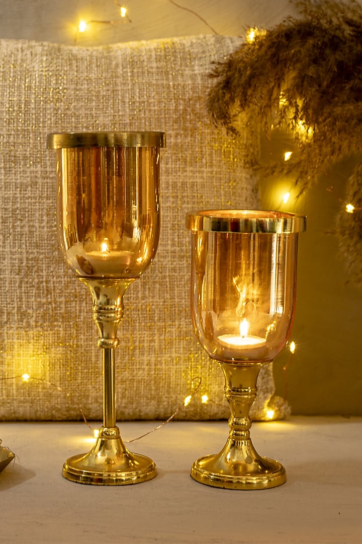 Gold Glass & Metal Hurricane Candle Holder (Set of 2) by The 7 Dekor at Pernia's Pop Up Shop