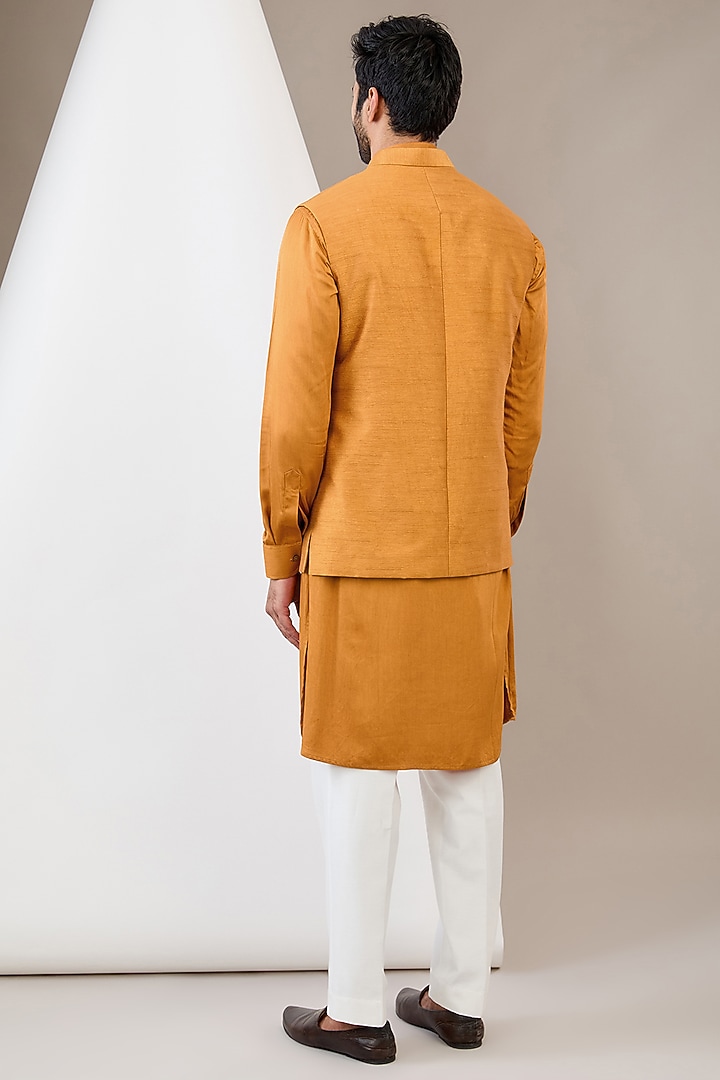 Mustard Raw Silk Motif Embroidered Bundi Jacket Set by Dev Kumar at Pernia's Pop Up Shop