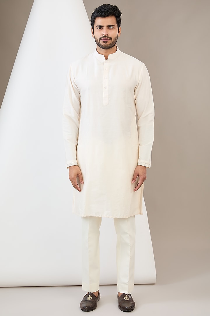 Ivory Raw Silk Resham & Cutdana Embroidered Bundi Jacket Set by Dev Kumar at Pernia's Pop Up Shop