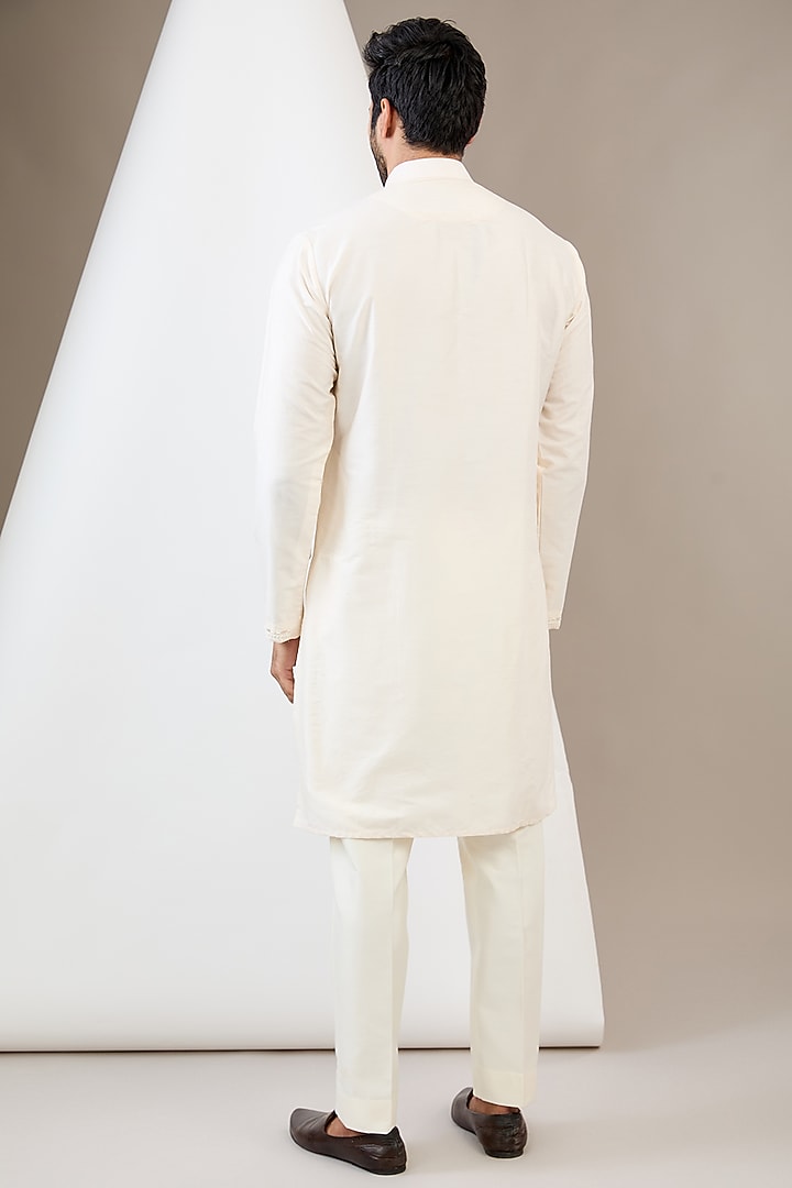 Ivory Raw Silk Resham & Cutdana Embroidered Bundi Jacket Set by Dev Kumar at Pernia's Pop Up Shop