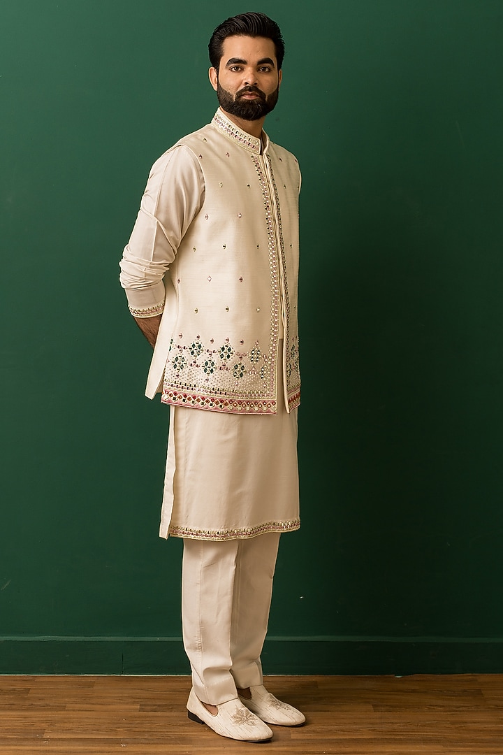 Ivory Raw Silk Resham Embroidered Nehru Jacket Set by Dev Kumar at Pernia's Pop Up Shop