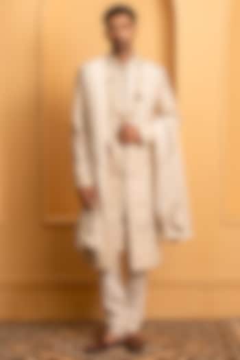 Beige Raw Silk Hand Embroidered Groom Sherwani Set by Dev Kumar at Pernia's Pop Up Shop