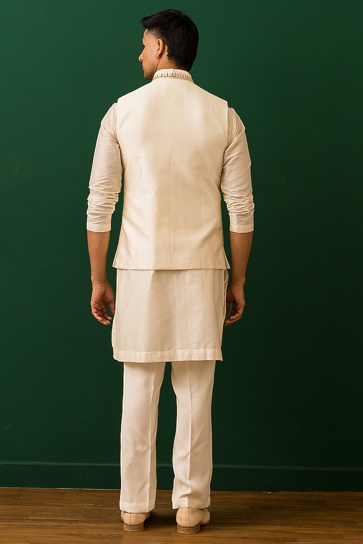 Ivory Raw Silk Resham Embroidered Bundi Jacket Set by Dev Kumar at Pernia's Pop Up Shop