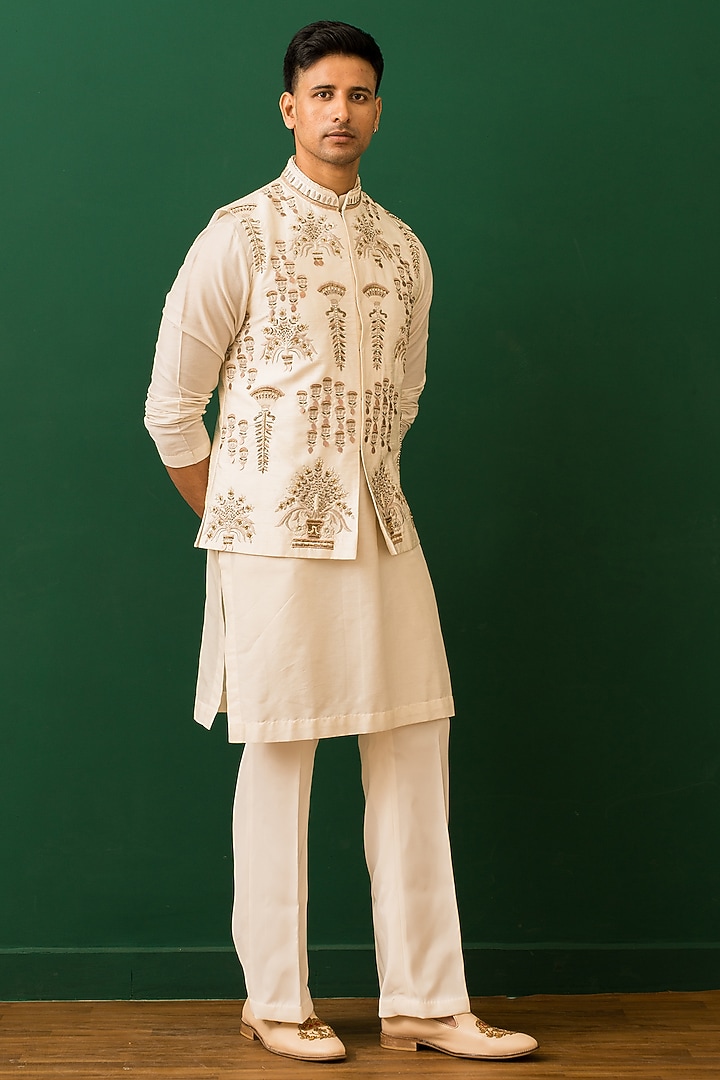 Ivory Raw Silk Resham Embroidered Bundi Jacket Set by Dev Kumar at Pernia's Pop Up Shop