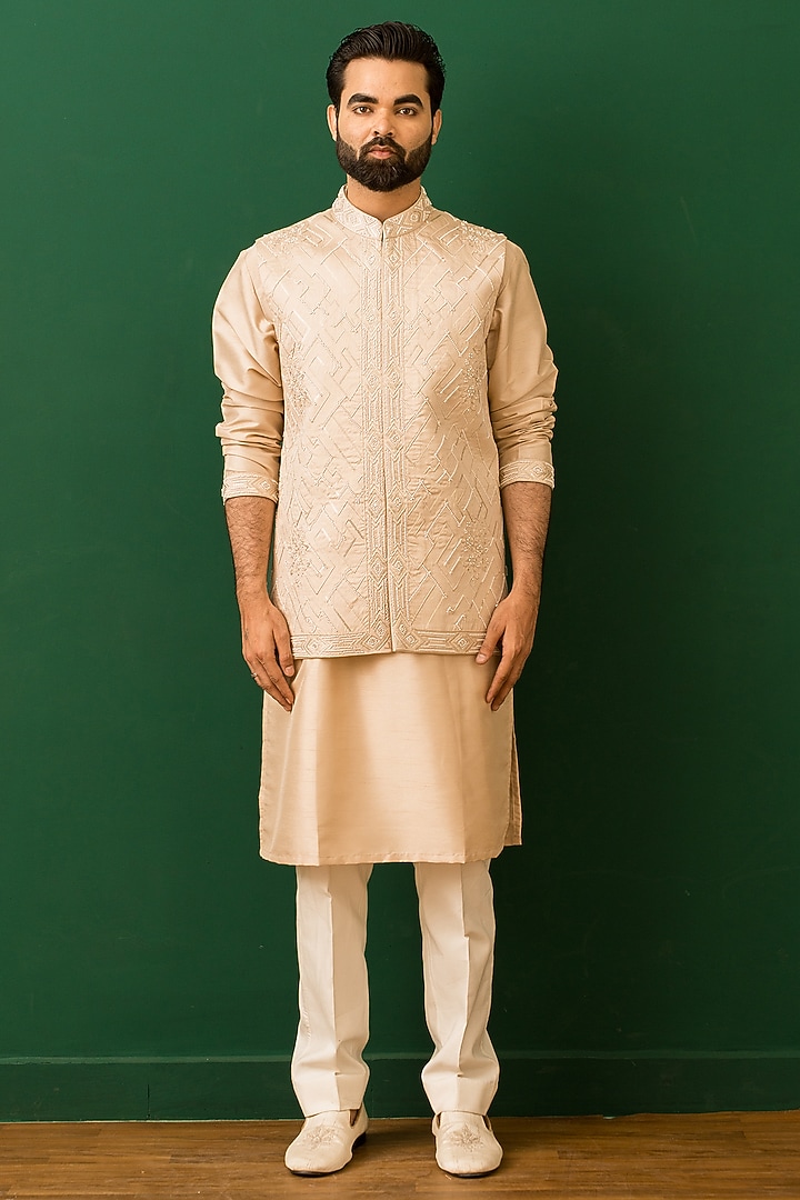 Beige Raw Silk Resham Embroidered Bundi Jacket Set by Dev Kumar at Pernia's Pop Up Shop