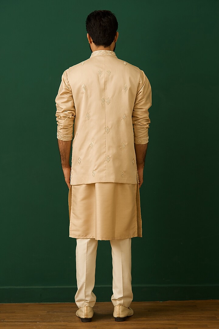Beige Raw Silk Resham Embroidered Bundi Jacket Set by Dev Kumar at Pernia's Pop Up Shop