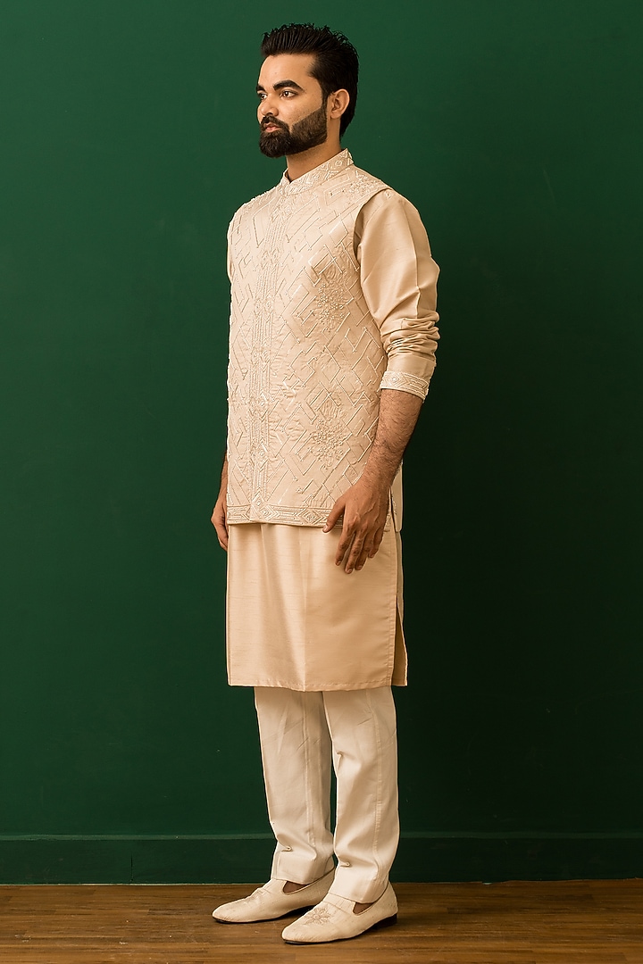 Beige Raw Silk Resham Embroidered Bundi Jacket Set by Dev Kumar at Pernia's Pop Up Shop