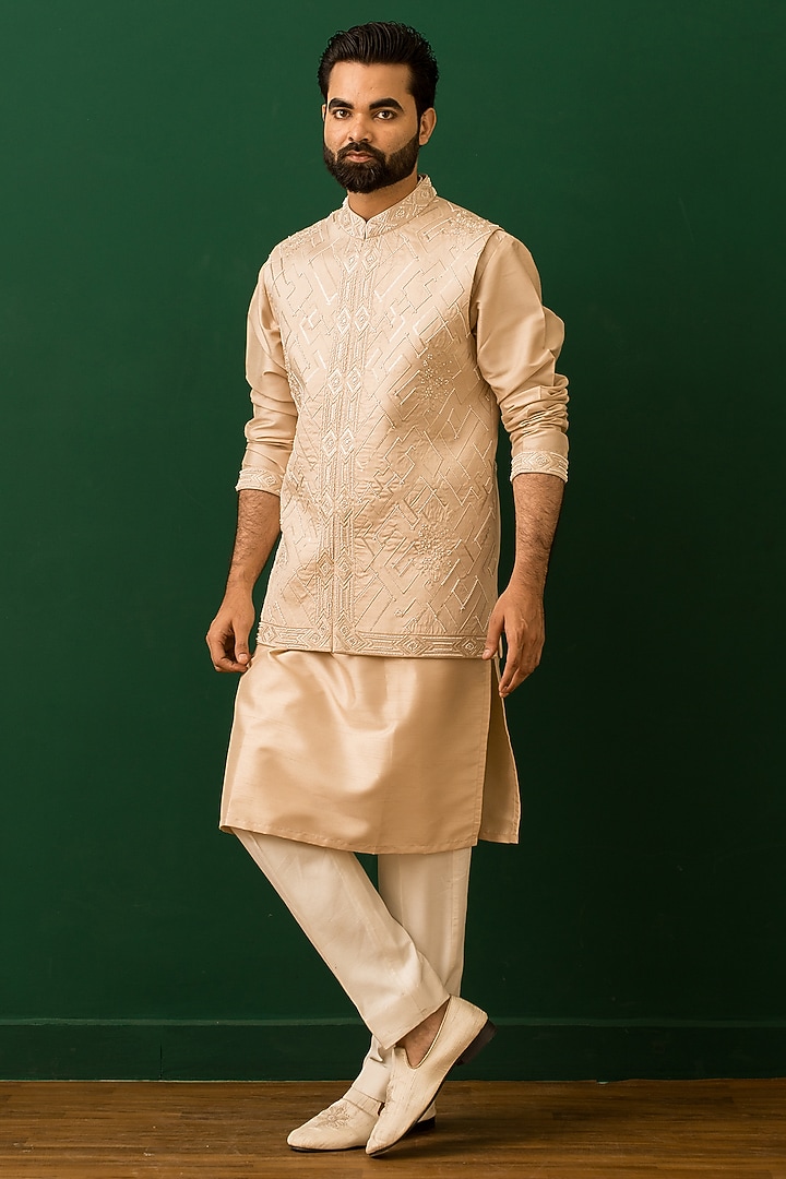 Beige Raw Silk Resham Embroidered Bundi Jacket Set by Dev Kumar at Pernia's Pop Up Shop