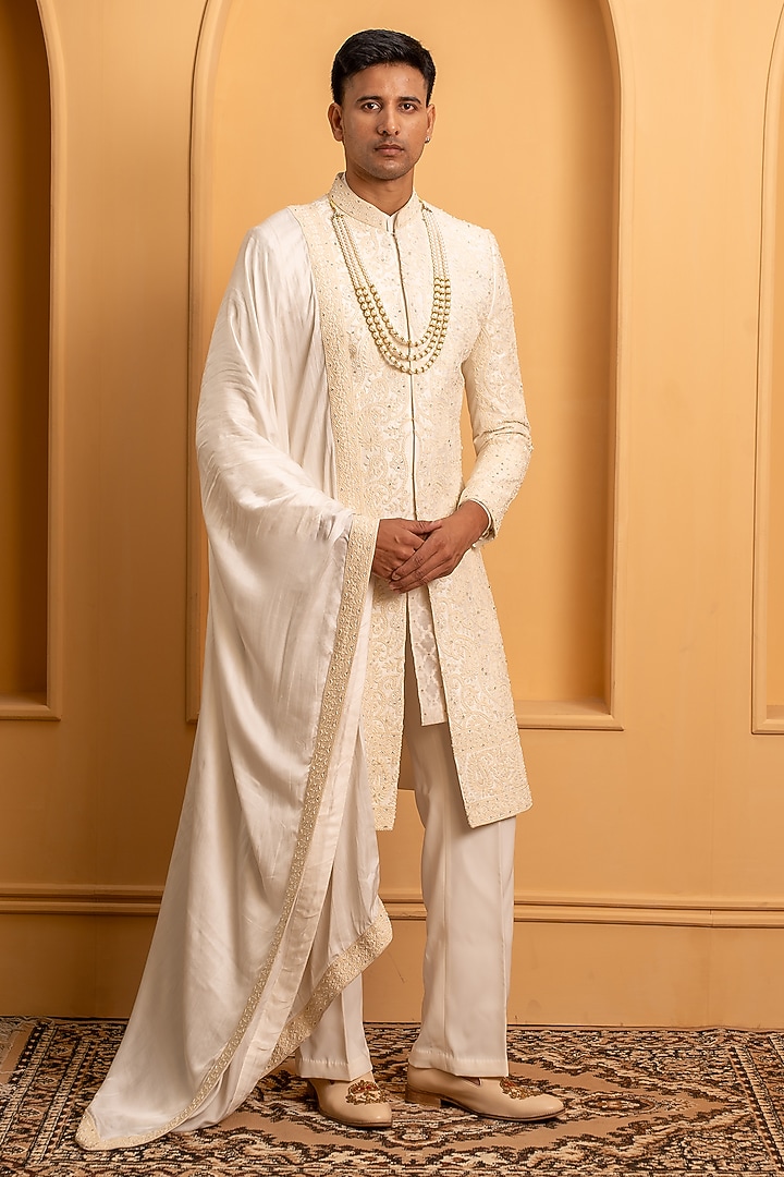Ivory Raw Silk Handwork Groom Sherwani Set Set by Dev Kumar at Pernia's Pop Up Shop