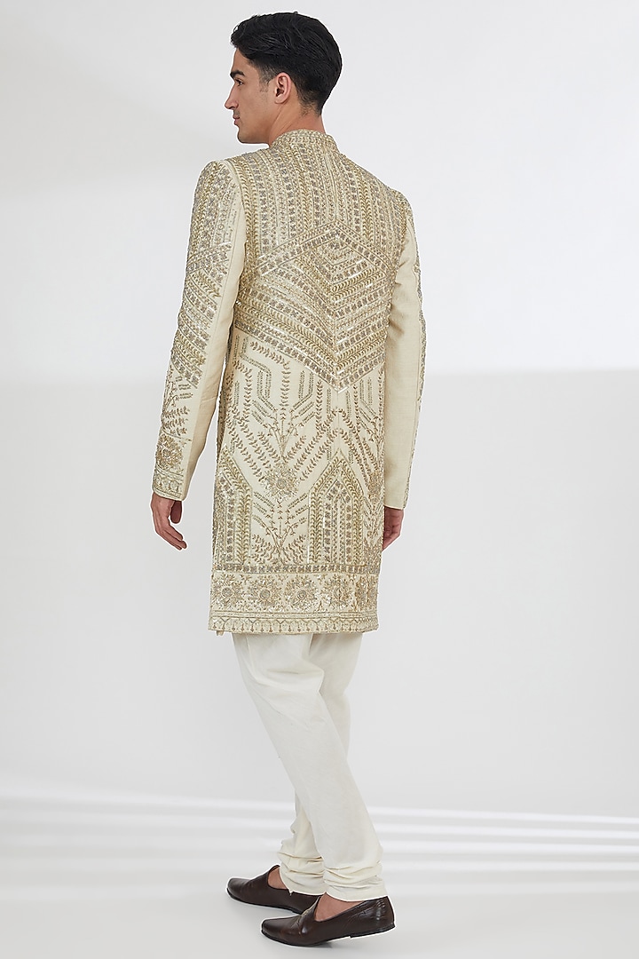 Gold Raw Silk Sequins & Pearl Hand Embroidered Groom Sherwani Set by Dev Kumar at Pernia's Pop Up Shop