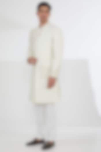 Ivory Raw Silk Sequins & Resham Embroidered Groom Sherwani Set by Dev Kumar at Pernia's Pop Up Shop