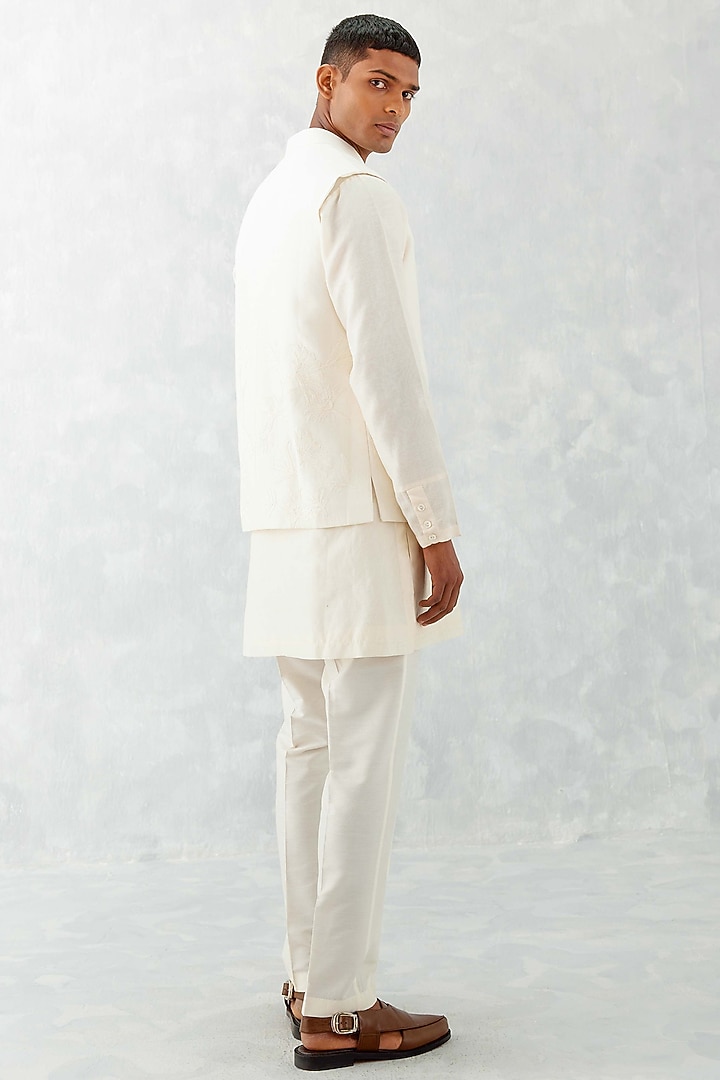 Ivory Linen Satin Thread Embroidered Bundi Jacket Set by Devnaagri Men at Pernia's Pop Up Shop