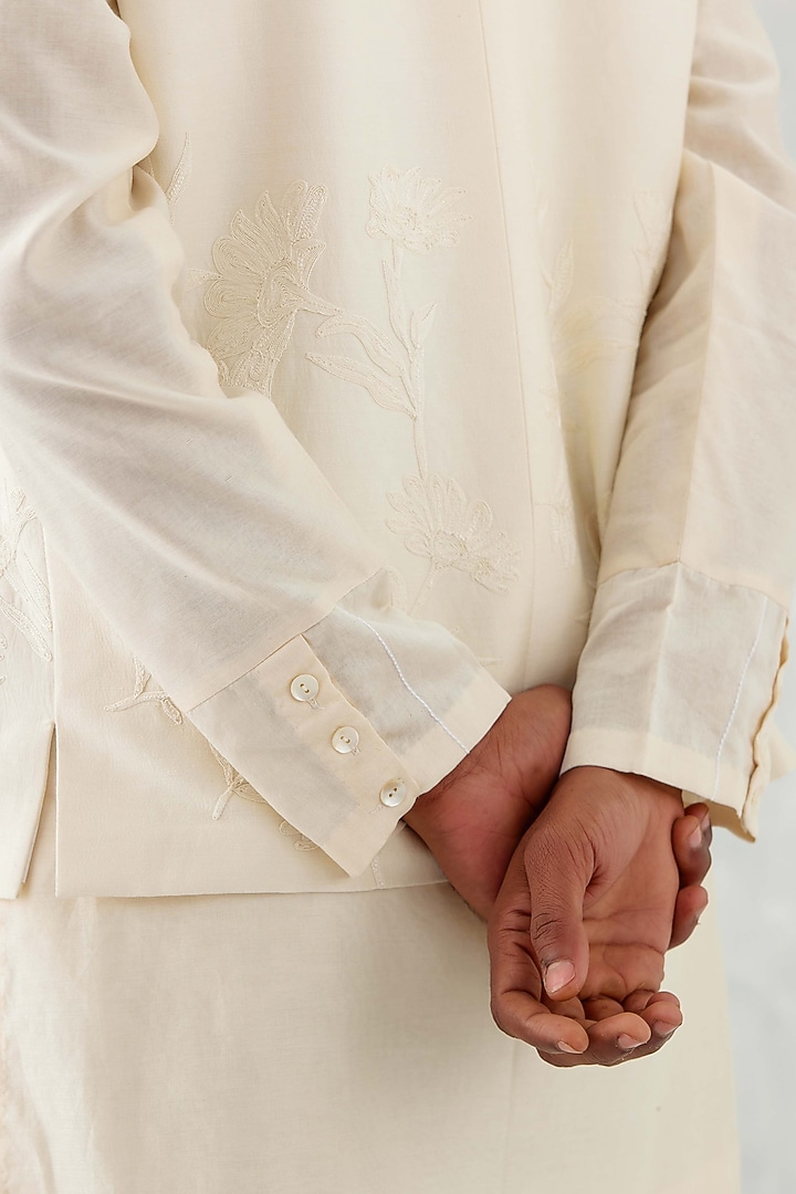 Ivory Linen Satin Thread Embroidered Bundi Jacket Set by Devnaagri Men at Pernia's Pop Up Shop