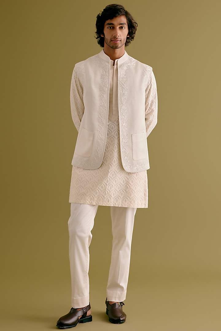 Ivory Silk Satin Dori Embroidered Bundi Jacket Set by Devnaagri Men at Pernia's Pop Up Shop